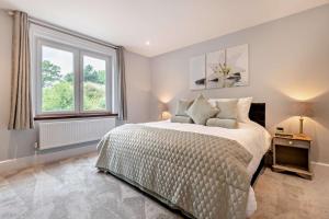 a bedroom with a large bed and a window at 3 Bed in Timsbury oc-h29584 in Timsbury +14 photos