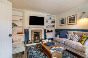 a living room with a couch and a fireplace at 2 Bed in Snettisham oc-t29559 in Snettisham