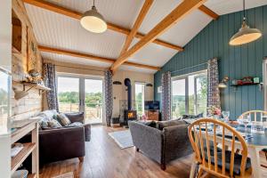 a living room with a couch and a table at 1 Bed in Dre-Fach Felindre oc-a29876 in Felindre