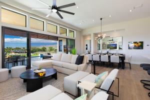 a living room with white furniture and a dining room at ❤PiH❤ Hale Kailani Heated Private Pool Spa in Waimea
