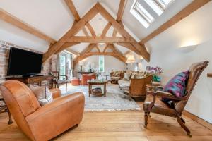 a living room with exposed beams and a tv at 4 Bed in Wareham oc-r30563 in Wareham