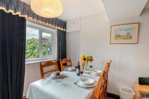 a dining room with a table and a window at 3 Bed in Carperby oc-e30625 in Carperby