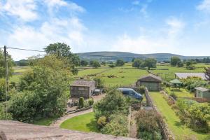 an aerial view of a farm with a car parked in a field at 3 Bed in Carperby oc-e30625 in Carperby