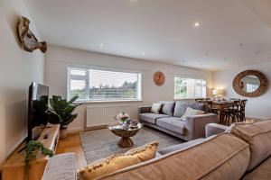 a living room with a couch and a table at 3 Bed in Aberdovey oc-n29124 in Aberdyfi
