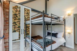 a bedroom with two bunk beds in a room at 5 Bed in Haceby oc-c31061 in Haceby +24 photos