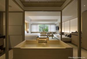 a hotel room with a bed and a bath tub at Banyan Tree Higashiyama Kyoto in Kyoto +178 photos