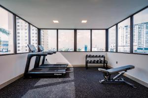 a gym with two treadmills and a treadmill at Palago Binh Thanh Hotel in Ho Chi Minh City