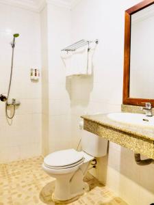 a bathroom with a toilet and a sink at VPlus Hotel in Siem Reap +33 photos
