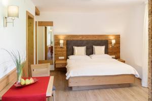 Postel nebo postele na pokoji v ubytování Hotel Garni Ingeborg