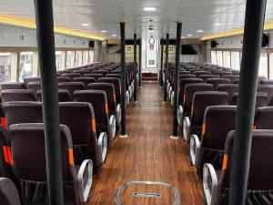 an empty bus with empty seats on a bus at GiliTicket fast ferries in Padangbai +8 photos
