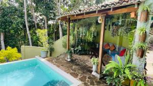 a house with a swimming pool in a yard at Bouganvilla House in Unawatuna