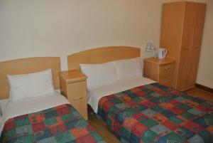 Postel nebo postele na pokoji v ubytování European Hotel