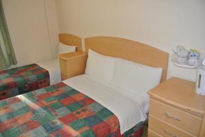 Postel nebo postele na pokoji v ubytování European Hotel