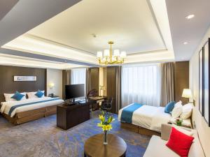 Postel nebo postele na pokoji v ubytování Wan Yue Grand Skylight Hotel + 37 fotografií