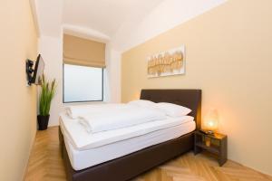 Posteľ alebo postele v izbe v ubytovaní Vienna Stay Apartments Belvedere