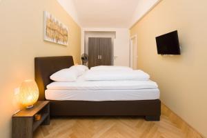 Posteľ alebo postele v izbe v ubytovaní Vienna Stay Apartments Belvedere