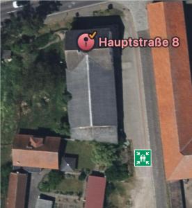 an overhead view of a street with a house and a sign at Tanne Grand Palace in Alleringersleben