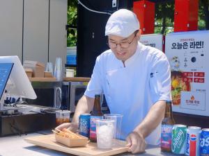 a man in a kitchen preparing food on a cutting board at Nami Island Hotel Jeonggwanru in Chuncheon +25 photos