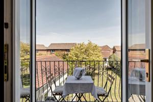 a table and chairs sitting on a balcony at 4 Bed in Nottage oc-a32048 in Nottage