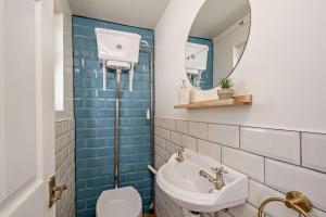a bathroom with a sink and a toilet and a mirror at 4 Bed in Nottage oc-a32048 in Nottage +30 photos