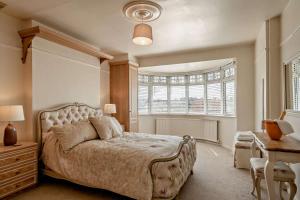 a bedroom with a large bed and a window at 4 Bed in Nottage oc-a32048 in Nottage