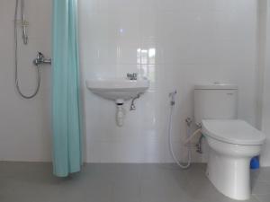 a bathroom with a toilet and a sink at Villa Stella Garden in Senggigi +35 photos