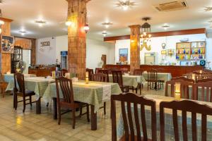 a restaurant with tables and chairs and a bar at Sirin Hotel Hua Hin in Hua Hin