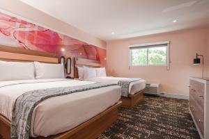 a hotel room with two beds and a window at The Bentley Hotel Southampton in Southampton +46 photos