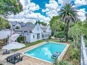 an exterior view of a house with a swimming pool at French Bistro Studio in Johannesburg
