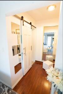 a room with a door leading to a living room at silver in Chatsworth