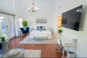 a bedroom with a bed and a couch and a table at silver in Chatsworth