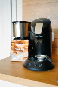 a coffee maker sitting on a counter next to a bag of chips at Ferienhaus DONAUzeit in Sigmaringen