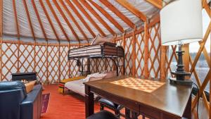 a wooden table in a yurt with a chessboard at Yurt 1 - The Prospector in Idaho City