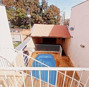 a balcony of a house with a swimming pool at Edicula Paz e Amor in Piracicaba