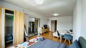 a living room with a couch and a table at Vista Residence Old Town in Phuket