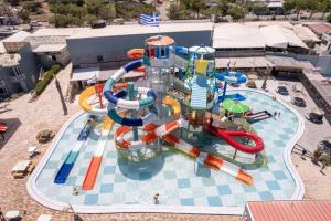 an aerial view of a water park with a water slide at SunBay Hotel in Hersonissos