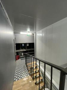 a hallway with a staircase in a room at Hotel Hc Luxury Apartment in Hanoi