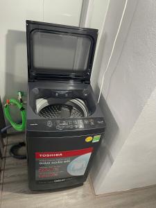 a toaster oven is sitting on top of a box at Hotel Hc Luxury Apartment in Hanoi