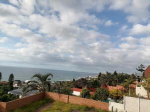 a view of the ocean from the roof of a house at Nomty House in Durban