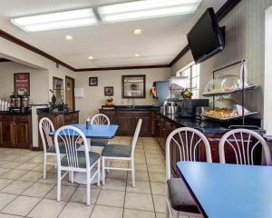 a large kitchen with a blue table and chairs at Econo Lodge Inn & Suites El Paso West in El Paso +22 photos