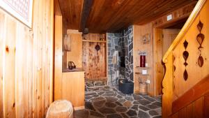 a bathroom with a toilet in a wooden house at Rustico Pagrüeg - Swiss Alpine Charm 1-5 Pers in Klosters Serneus +40 photos