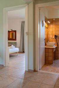 a bathroom with a tub and a sink in a room at Pargadise Aprtments in Parga +277 photos