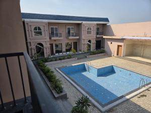 an aerial view of a house with a swimming pool at R N Hotel & Lawn in Katra