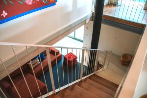 an overhead view of a staircase with a stair railing at Just Like Home - Casa da Tuca in Moledo +48 photos
