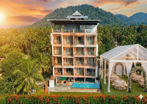 a building with a pool and a gazebo at River Bay Athirappilly in Athirappilly