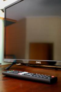 a remote control sitting on top of a computer monitor at Curtain Fig Motel in Yungaburra