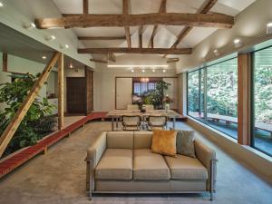a living room with a couch and a table at shinso hakone in Hakone +54 photos