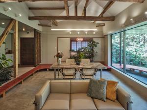a living room with a couch and a table at shinso hakone in Hakone