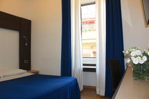 Postel nebo postele na pokoji v ubytování Hotel Louisiana