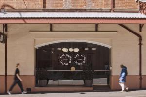 two people walking in front of a store window at The Ultimo in Sydney